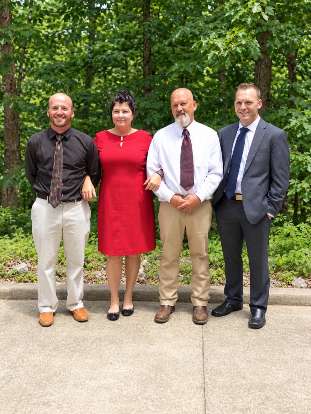 Dad with the family, standing together outdoors